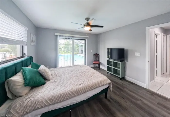 Bedroom with access to exterior, and ceiling fan