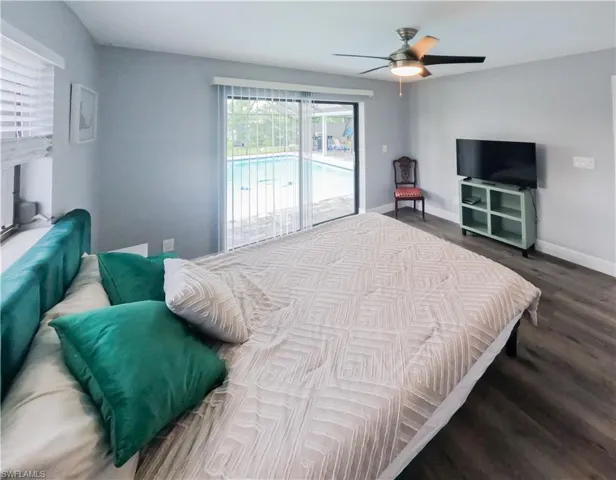 Bedroom with access to exterior, and ceiling fan