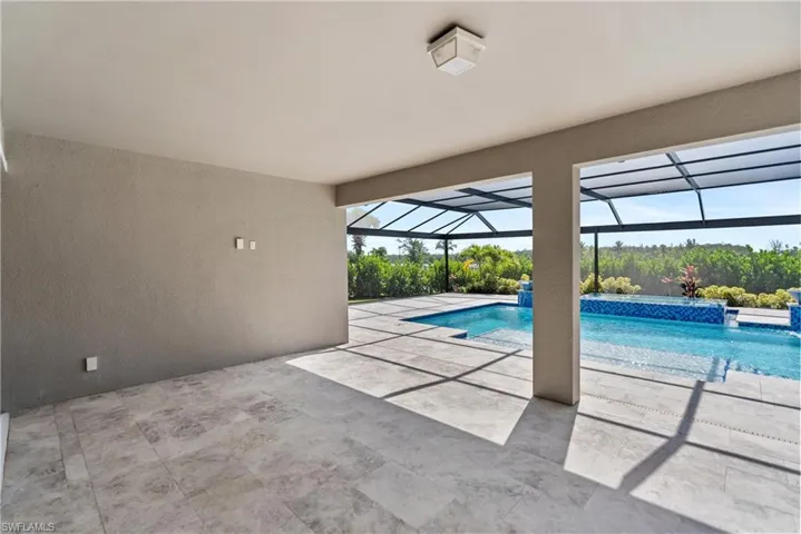 Outdoor pool featuring a lanai