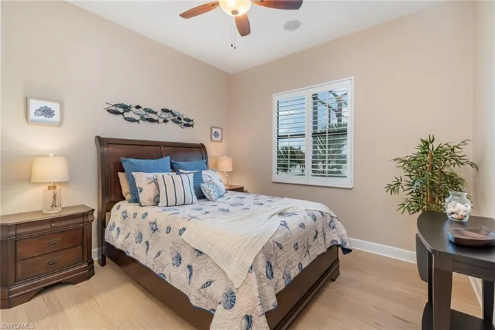 Bedroom with ceiling fan and light hardwood / wood-style floors