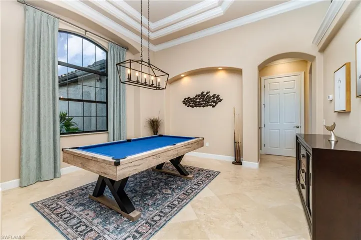 Game room featuring pool table and crown molding