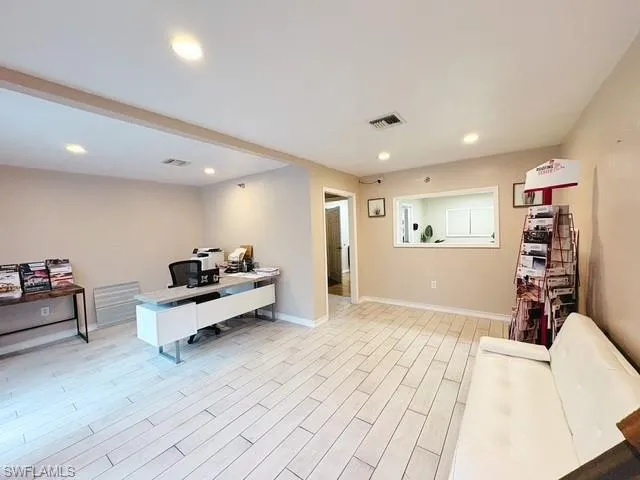 Office area featuring recessed lighting and light wood-style flooring