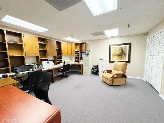 Office area featuring a paneled ceiling