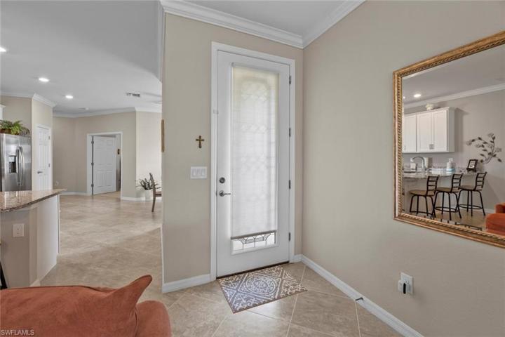 Entryway, to this light and bright Great Room floor plan home that offers 3 bedrooms & 2 bathrooms.