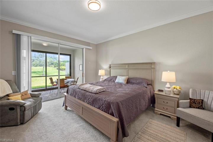 Great sized Master Bedroom with sliders leading out the the lanai.