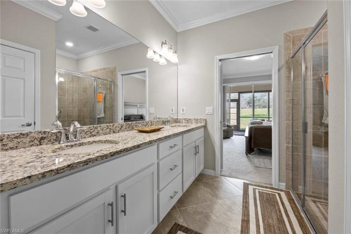 Dual sinks, generous walk-in shower Master Bathroom.