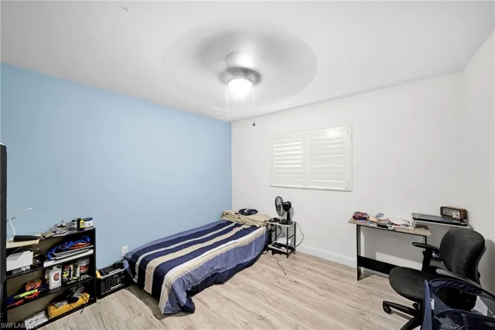 Bedroom with light wood-style flooring and ceiling fan
