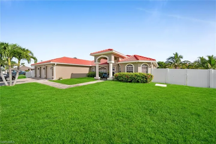 Mediterranean / spanish-style home featuring stucco siding, concrete driveway, a garage, and a tiled roof