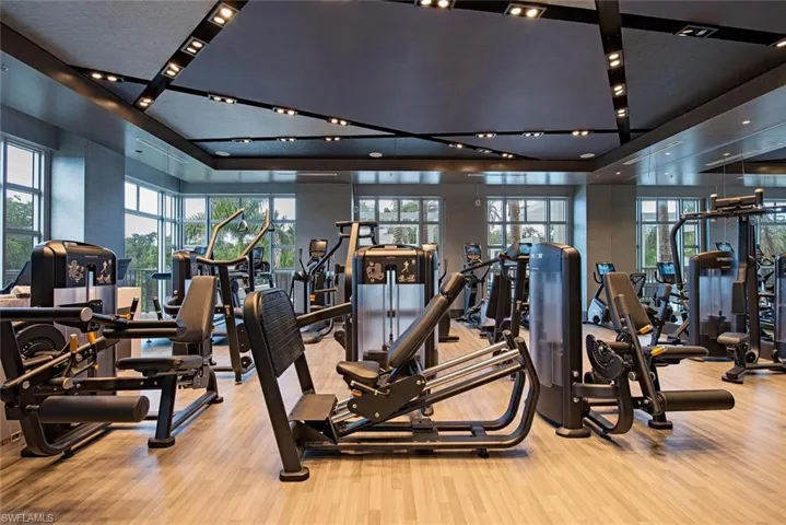 Gym with light hardwood / wood-style flooring