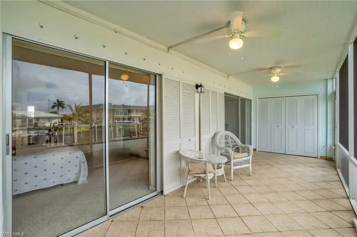 Sunroom featuring ceiling fan