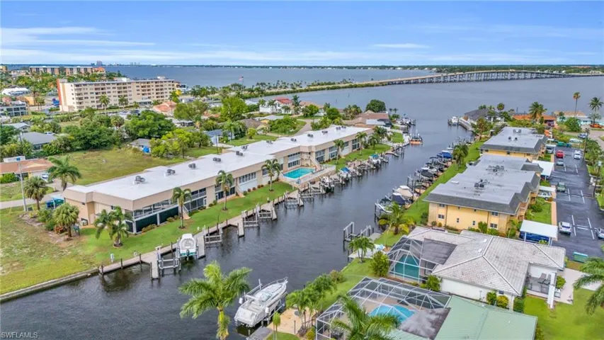 Birds eye view of property with a water view