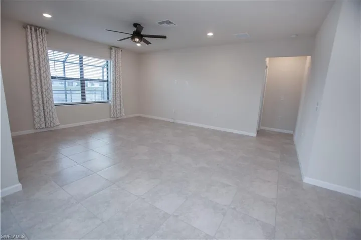 Unfurnished room featuring a ceiling fan and recessed lighting
