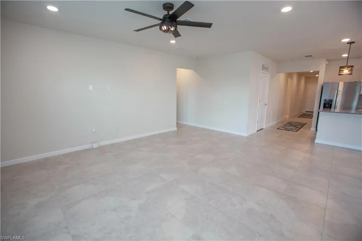 Unfurnished living room with recessed lighting and a ceiling fan
