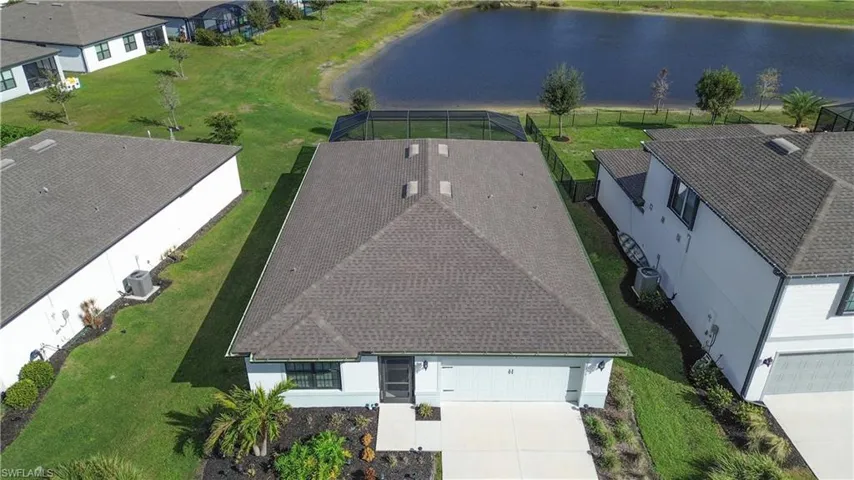 Birds eye view of property featuring a residential view and a water view