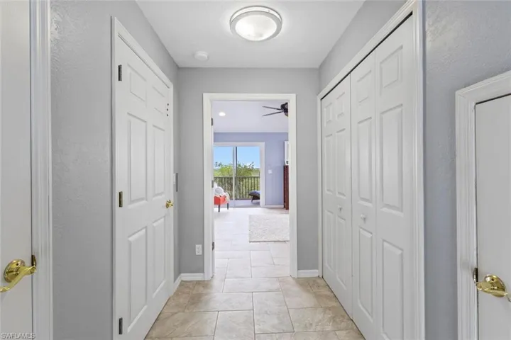 Entrance to the primary suite. Elevator to the left. Laundry to the right