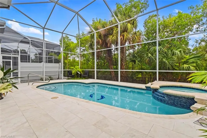 Large screened pool deck (with both a heated pool & spa) with mangroves behind you.