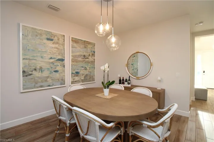 Dining room featuring dark wood-type flooring