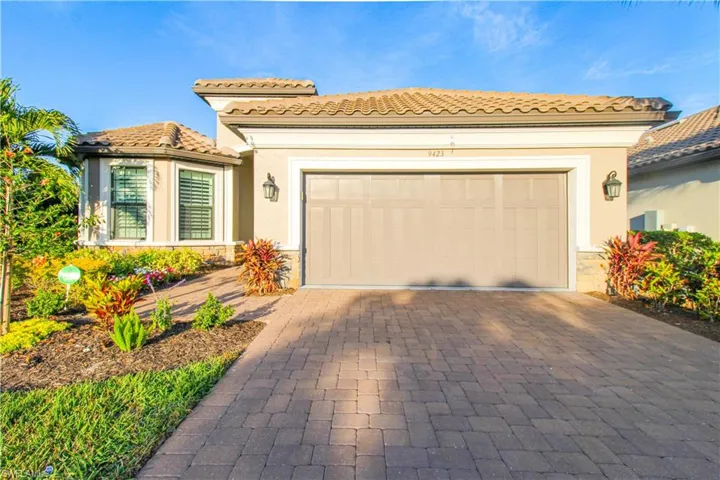 Mediterranean / spanish-style home featuring a garage