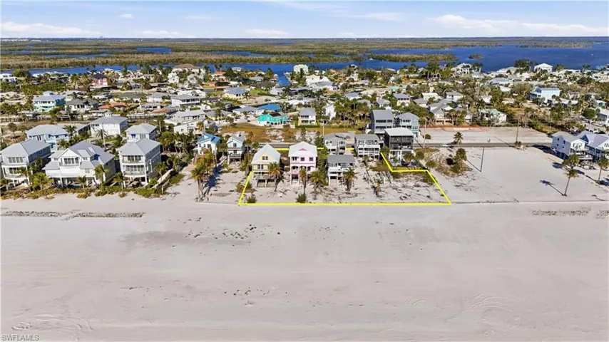 Aerial perspective of suburban area featuring a large body of water