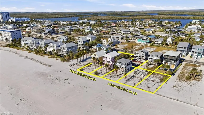 Aerial overview of property's location featuring property parcel outlined and a nearby body of water