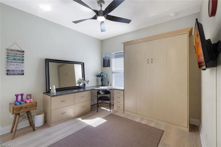 Bedroom with Murphy bed and built in desk