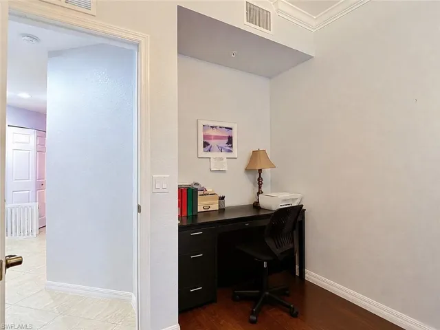 Dedicated office nook featuring wood-finish flooring
