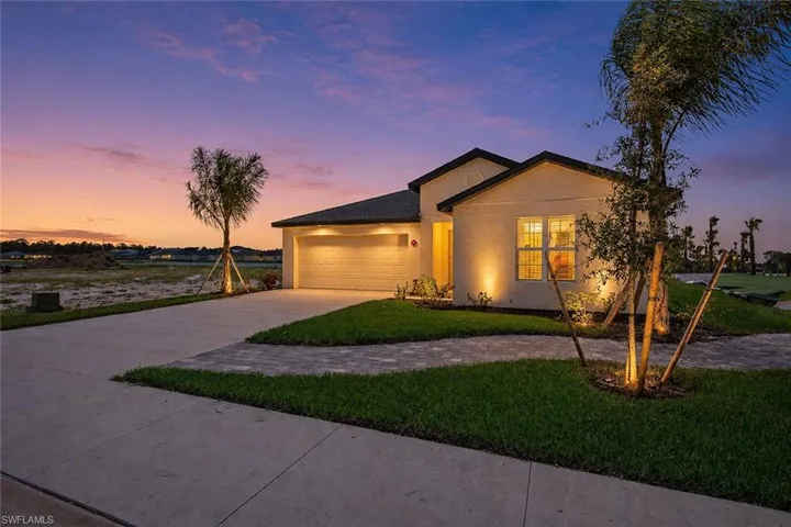 Contemporary stucco exterior with dark trim accents