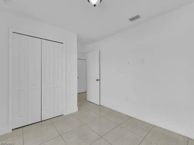 3rd Unfurnished bedroom with a closet and window facing the front of the house