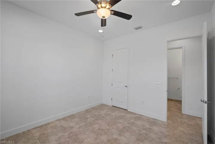 Unfurnished bedroom with a ceiling fan and recessed lighting