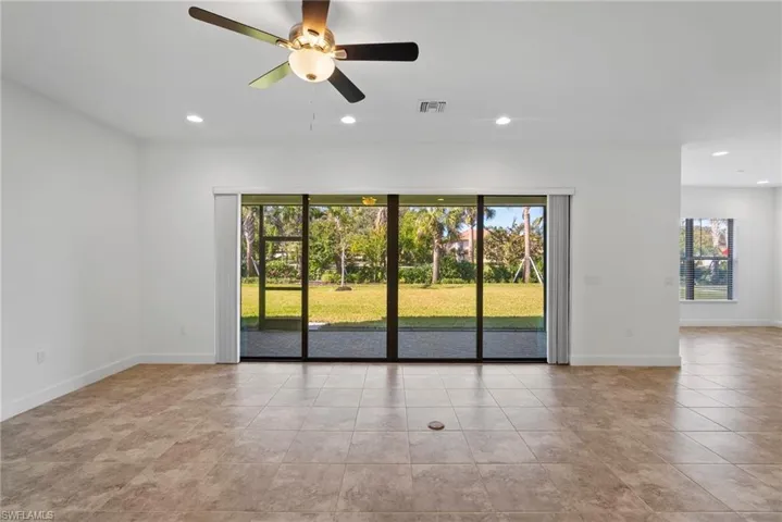 Unfurnished room with recessed lighting, a ceiling fan, and light tile patterned floors