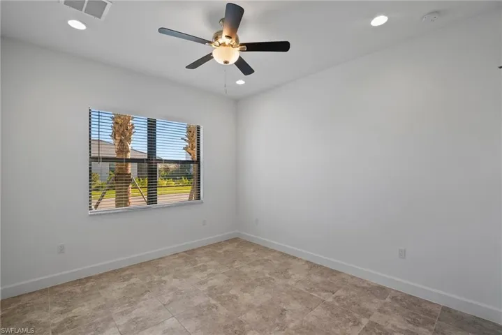 Spare room featuring a ceiling fan and recessed lighting