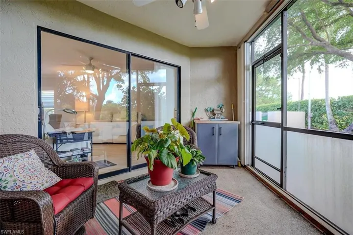 Sunroom featuring ceiling fan