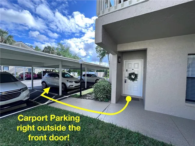 View of vehicle parking with a carport