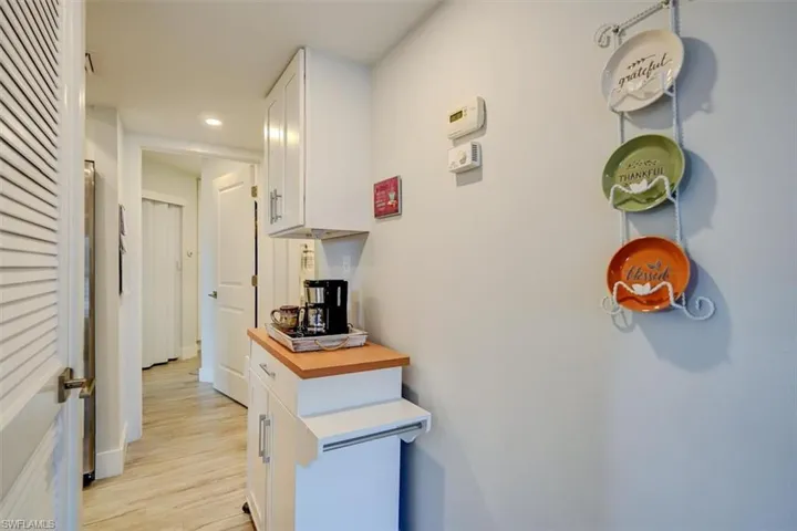 Corridor with light hardwood / wood-style floors