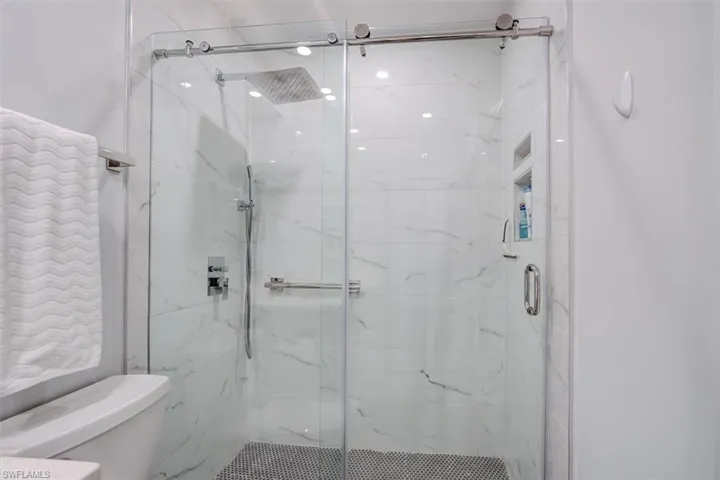 Bathroom with toilet and walk in shower