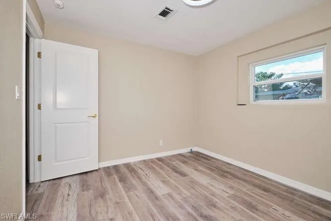 Empty room featuring light hardwood / wood-style flooring
