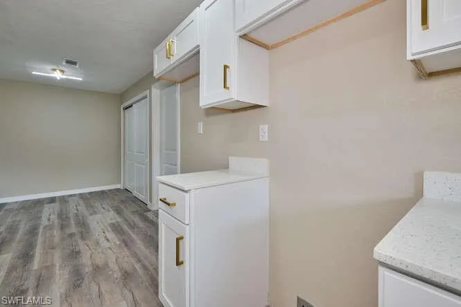 Laundry room featuring light hardwood / wood-style floors