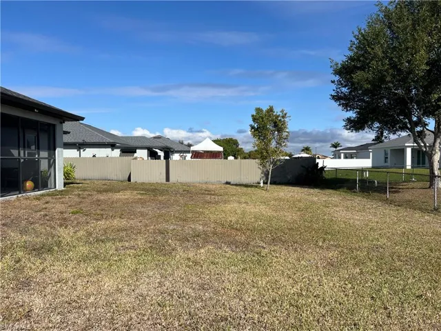 View of yard featuring a sunroom