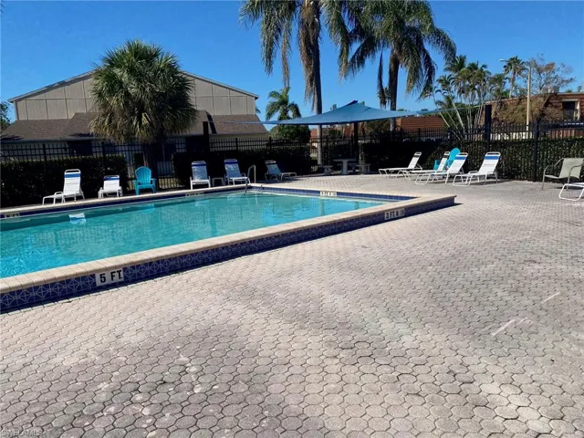 Community pool with a patio area.