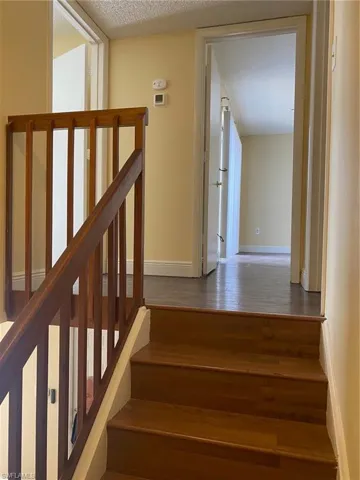 Staircase featuring vinyl steps.