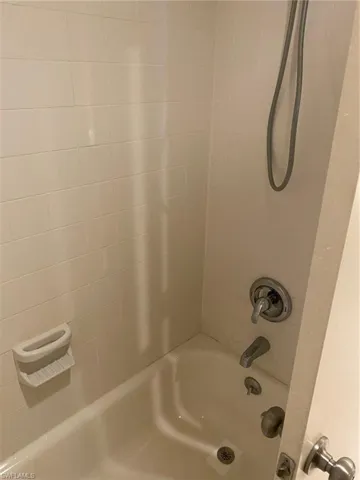 Bathroom featuring tub/  shower combination.