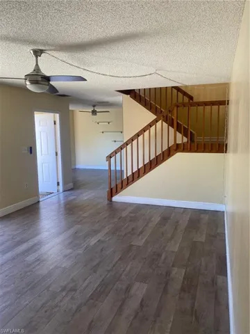 Family room featuring vinyl floors, and a ceiling fan.