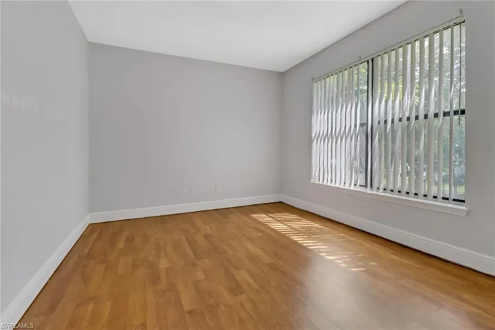 Spare room featuring light wood-type flooring