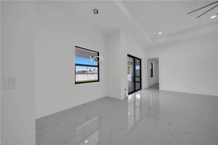Unfurnished room featuring light marble finish floors, recessed lighting, and ceiling fan