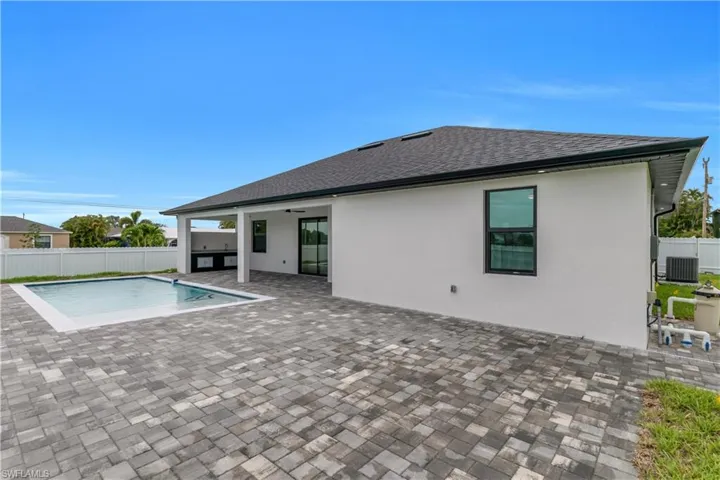 View of pool featuring a patio area and a ceiling fan