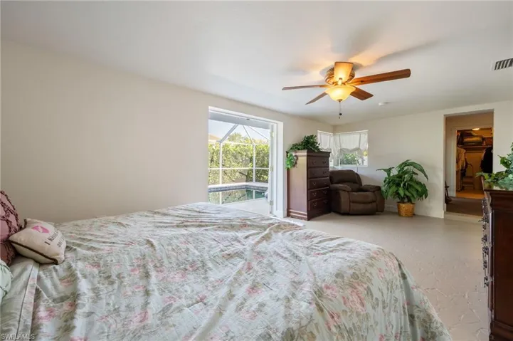 Bedroom with access to outside and ceiling fan
