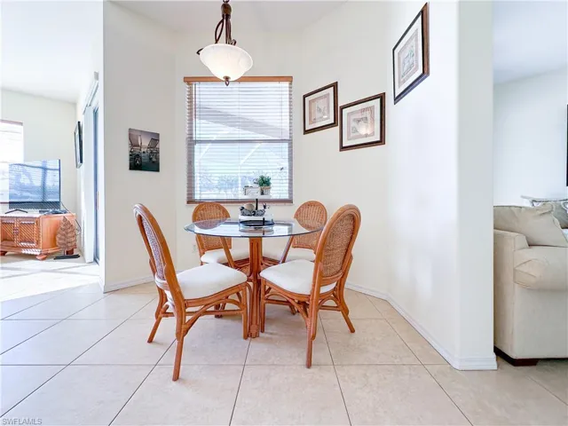 Dining room featuring light tile patterned flooring