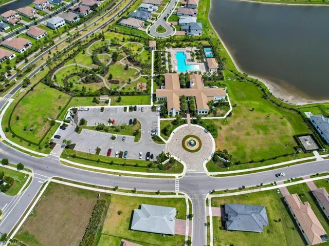 Aerial view of property's location with nearby suburban area and a nearby body of water
