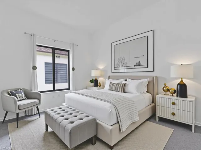 Carpeted bedroom featuring baseboards