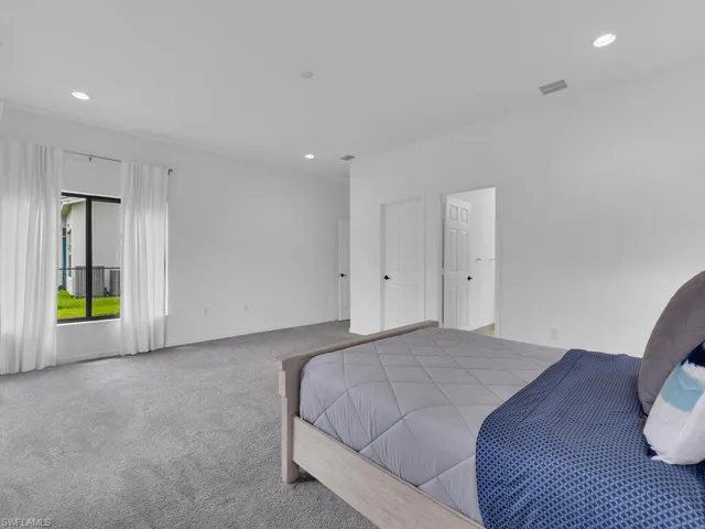 Bedroom featuring carpet and recessed lighting